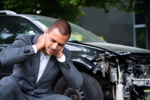 Man experiencing neck pain after car accident